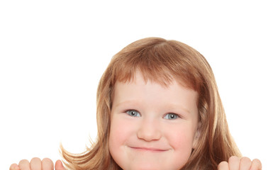 Cute little girl leaning on a billboard