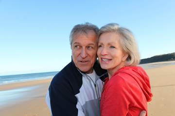 Senior couple exercising by the sea