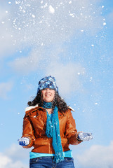 Teenage Girl playing with snow