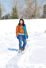 Teenage girl surrounded by snow