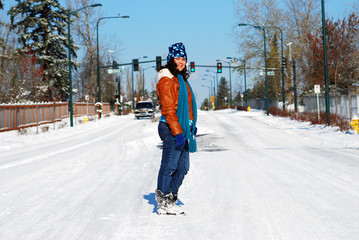 Girl standing on a snowy street