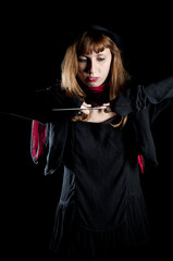 dark girl with red scarf and black hat rusty scissors