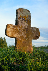 Stone cross near road