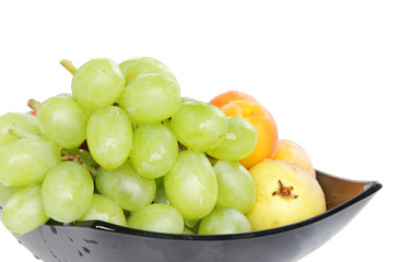 Healthy fruits in a bowl isolated on white