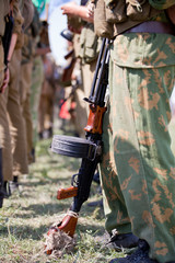 Low section of men with machine gun