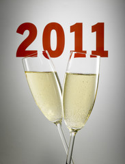 Two glasses of champagne toasting the year 2011