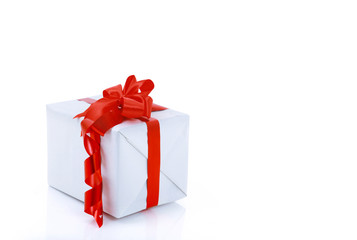 gift box wrapped with red ribbon with big bow isolated.