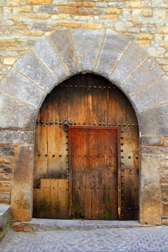 Romanesque arch door wooden medieval Ainsa