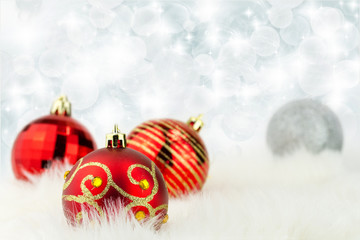 Fototapeta na wymiar Christmas balls with abstract lights background