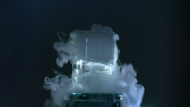 Dry ice sublimation in water with bubbles and fog