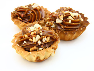 Pie a basket with chocolate condensed milk and nuts