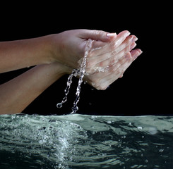 water in woman hands