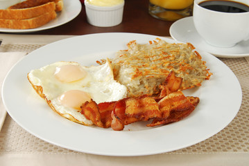Fried egg breakfast with bacon
