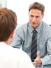 Charismatic manager during a meeting with an employee