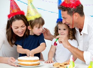 Brother and sister celebrating their birthday at home