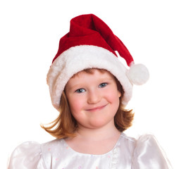 Portrait of pretty christmas girl in white dress and santa hat