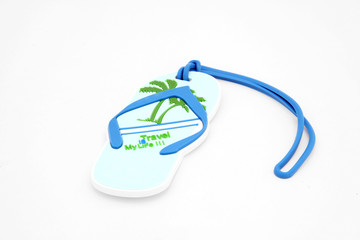 isolated luggage name tag in sandal shape