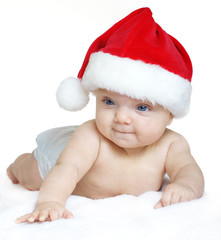 Baby girl wearing a Santa Claus hat