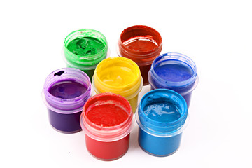 Colorful vibrant cans of gouache isolated on white