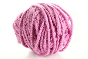 Pink ball of woollen red thread isolated on white