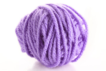 Purple ball of woollen red thread isolated on white