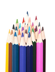 closeup stack of colored pencils isolated on white background