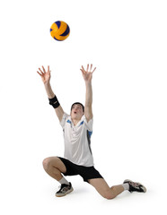 Volleyball player with the ball on a white