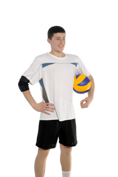 Volleyball player with the ball on a white