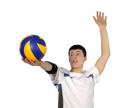 Volleyball player with the ball on a white