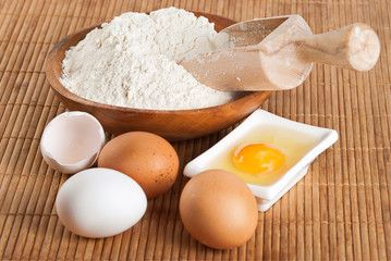 Fototapeta na wymiar Flour with raw egg for making dough