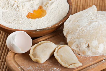 Flour, fresh dough, raw eggs and dough nuts