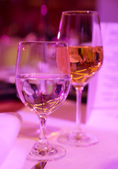 Glasses with white wine and water