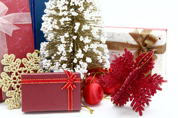 red holiday box with christmas tree and ornament