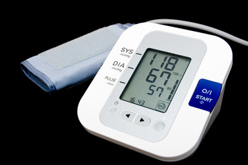 Digital blood pressure monitor isolated on black