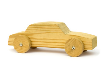 Old wooden homemade toy car on white background