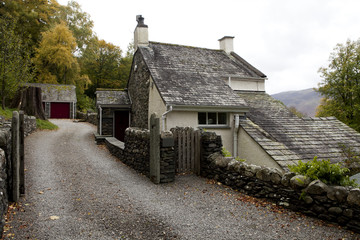 Fototapeta na wymiar old stone houses in village street in Lake District, Cumbria