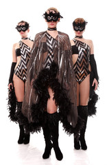 Three girls in suits from feathers and black masks