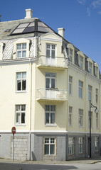 Obraz premium Old apartment building with modern roof window