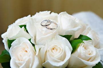 Gold wedding rings on the flower rose