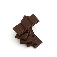 chocolate pieces on white background