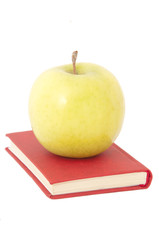 apple on book isolated on white background