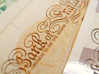 British Sterling pound currency banknotes and coins