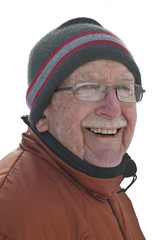 Senior man in snowy winter scene