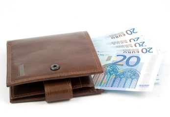 brown wallet and euros