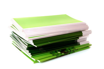 Pile of color magazines isolated on white background