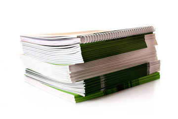 Pile of color magazines isolated on white background