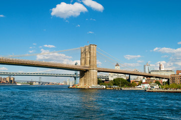 Brooklyn bridge in New York on bright summer day
