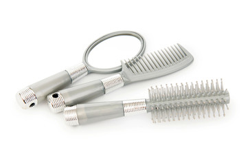 Grey hairbrushes isolated on the white background