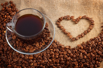 cup of coffee on the canvas with coffee beans