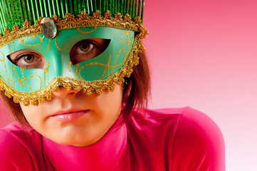 Attractive woman posing in the stylish mask